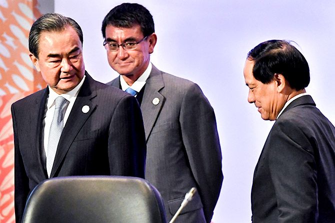China's Foreign Minister Wang Yi, left, with Japan's Foreign Minister Taro Kono and ASEAN Secretary General Le Luong Minh before the 18th ASEAN Plus Three Foreign Ministers Meeting, part of the 50th Association of ASEAN Regional Forum meeting in Manila, Philippines, August 7, 2017. Photograph: Mohd Rasfan/Pool/Reuters