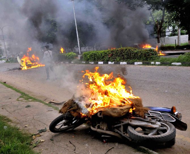 Vehicles burn in the violence in Panchkula, August 25, 2017. Photograph: PTI Photo