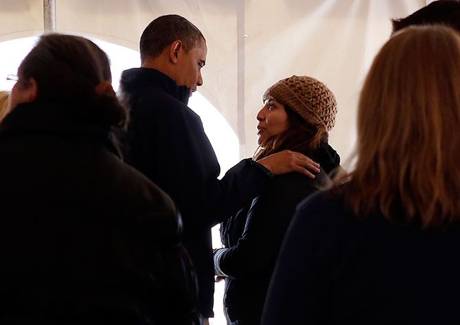 Barack Obama meets with residents affected by Hurricane Sandy at a Staten Island disaster recovery centre in New York, November 15, 2012.
