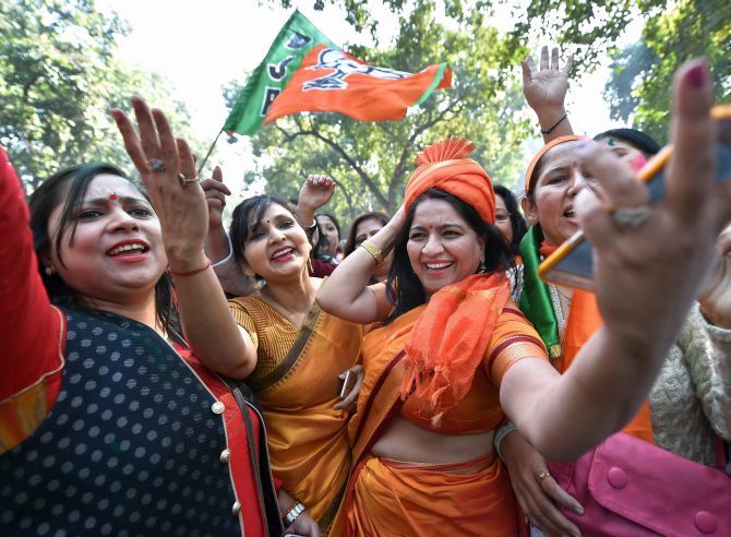 BJP supporters celebrate outside the party headquarters in New Delhi. Photograph: Arun Sharma/PTI Photo
