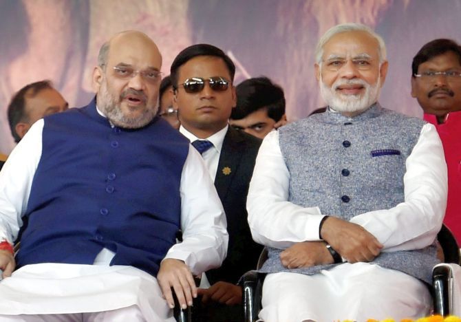 Prime Minister Narendra D Modi with Bharatiya Janata Party President Amit A Shah at the swearing of the Vijay Rupani government in Gujarat, December 26, 2017.  Photograph: Santosh Hirlekar/PTI Photo