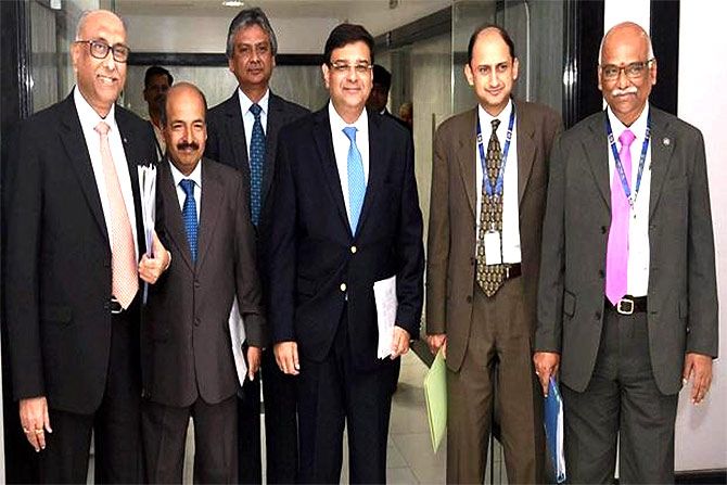 Reserve Bank of India Deputy Governor Dr Viral Acharya, second from right, with RBI Governor Dr Urjit Patel