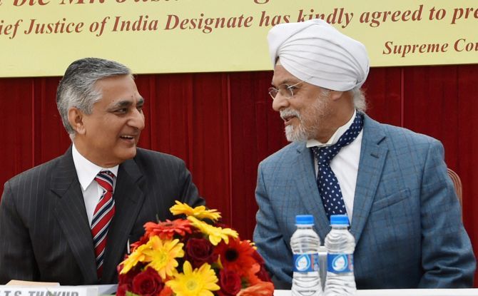 Outgoing Chief Justice of India Justice T S Thakur with CJI-designate Justice J S Khehar at his farewell ceremony in New Delhi on Tuesday, January 3, 2017. Photograph: Atul Yadav/PTI Photo