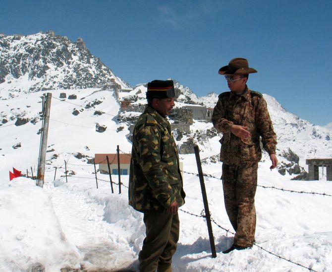 Indian and Chinese soldiers in friendlier times at Nathu La in Sikkim