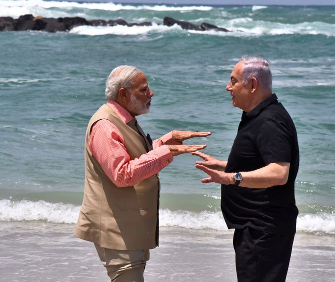 Prime Minister Narendra Modi and Israel Prime Minister Benjamin Netanyahu on an Israeli beach, July 6, 2017.