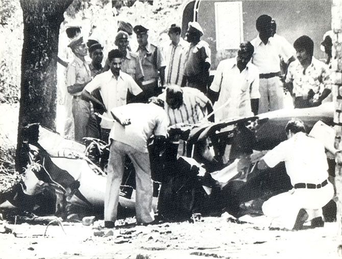 Investigators examine the wreckage of Sanjay Gandhi's Pitts S-2A plane. He had taken it for a joyride and lost control while doing aerobatics. Sanjay lost his life in the ensuing crash.