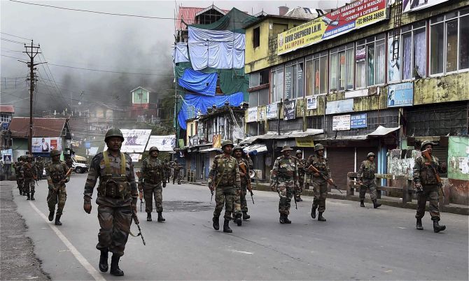 Security personnel march through violence-hit Darjeeling
