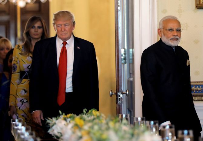 Prime Minister Narendra Modi, US President Donald Trump and First Lady Melania Trump arrive for a dinner at the White House. Photograph: Carlos Barria/Reuters