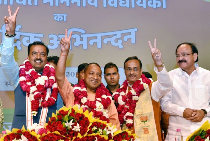 Yogi Adityanath flanked by Keshav Prasad Maurya and Dinesh Sharma on March 17, 2017, the day before they were sworn in as UP chief minister and deputy chief ministers respectively.