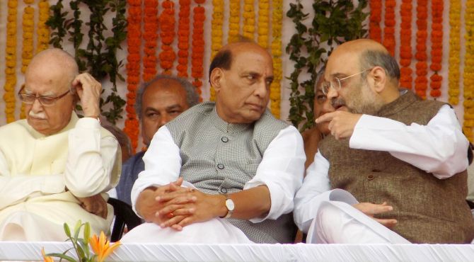 Bharatiya Janata Party President Amit Shah, right, with Home Minister Rajnath Singh, the BJP's tallest leader in UP who reportedly was forced to play a cameo role in the 2017 election campaign, as BJP veteran L K Advani, left, seems thoughtful at the UP chief minister's swearing in ceremony in Lucknow, March 19, 2017. Photograph: Sandeep Pal