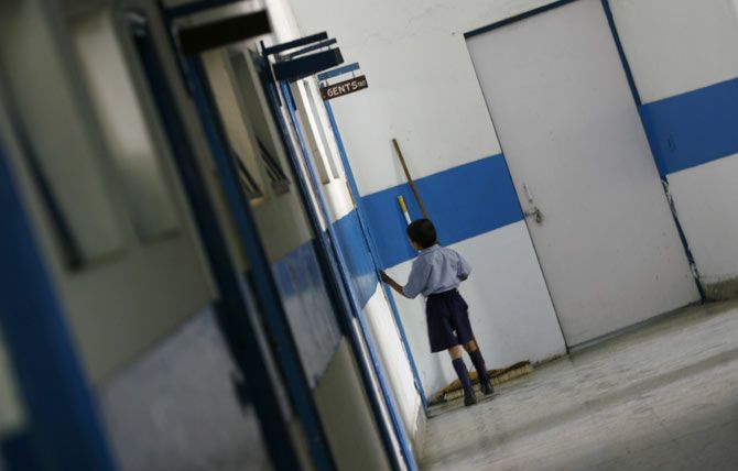 A student enters the bathroom at a school for the visually impaired, New Delhi, April 9, 2009. Photo: Adnan Abidi/Reuters