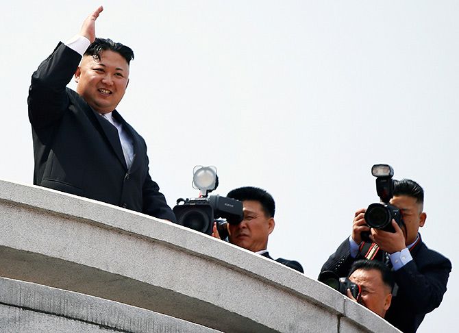  North Korean leader Kim Jong-un waves to people attending a military parade marking the 105th birth anniversary of the country's founder Kim Il-sung, in Pyongyang, April 15, 2017. Photograph: Damir Sagolj/Reuters