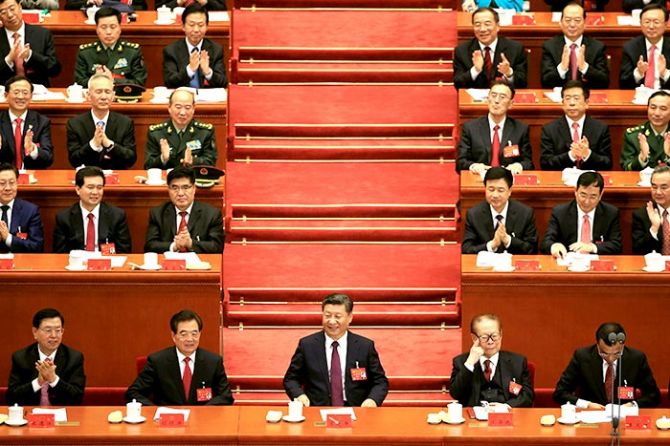 Xi Jinping, centre, flanked by from left, Zhang Dejiang, chairman of the standing committee of the National People's Congress, former Chinese presidents Hu Jintao and Jiang Zemin, and Chinese Premier Li Keqiang, at the opening of the 19th National Congress of the Communist Party of China at the Great Hall of the People in Beijing, October 18, 2017. Photograph: Aly Song/Reuters