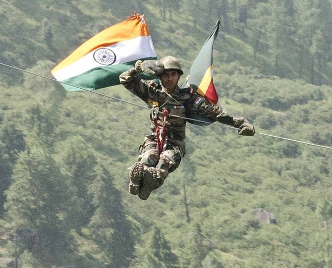 An Indian soldier with 12 Madras zip lines off a cliff at Chaubattia Military Station. This was part of a rappelling and a skirmish order demonstration for US and Indian soldiers during Yudh Abhyas 2016. Photograph: Staff Sgt Samuel Northrup/US Army photo