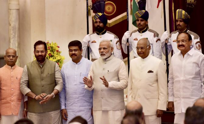 President Ram Nath Kovind, Vice President Muppavarapu Venkaiah Naidu, Prime Minister Narendra D Modi with Cabinet Ministers (to his right) Dharmendra Pradhan, Mukhtar Abbas Naqvi and Minister of State Shiv Pratap Shukla after the reshuffle.