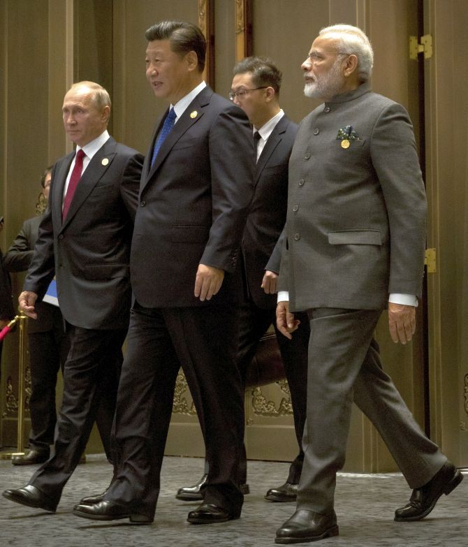 Chinese President Xi Jinping, Prime Minister Narendra D Modi, along with Russian President Vladimir Putin, arrive for the Dialogue of Emerging Market and Developing Countries in Xiamen, September 5, 2017. Photograph: Mark Schiefelbein/Pool/Reuters