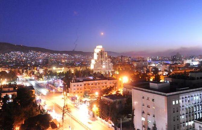 A missile is seen crossing over Damascus, April 14, 2018. Photograph: SANA/Handout via Reuters