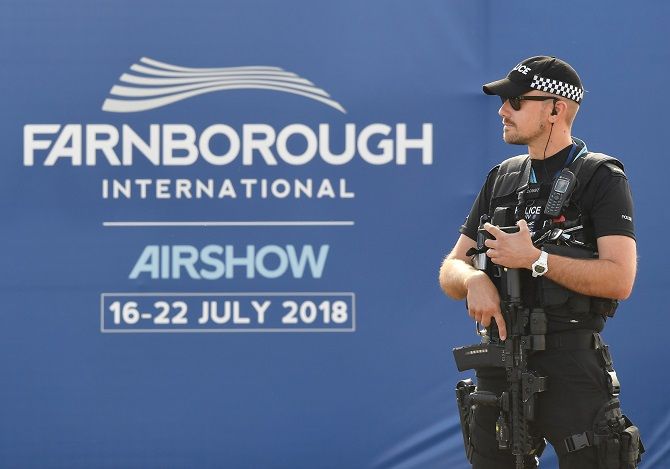 An armed police officer stands guard at the Farnborough  Airshow, July 17, 2018. Photograph: Toby Melville/Reuters