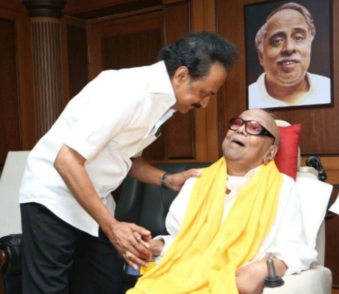 M K Stalin, who now heads the DMK, with his father M Karunanidhi under the watchful gaze of the party's legendary founder C N Annadurai