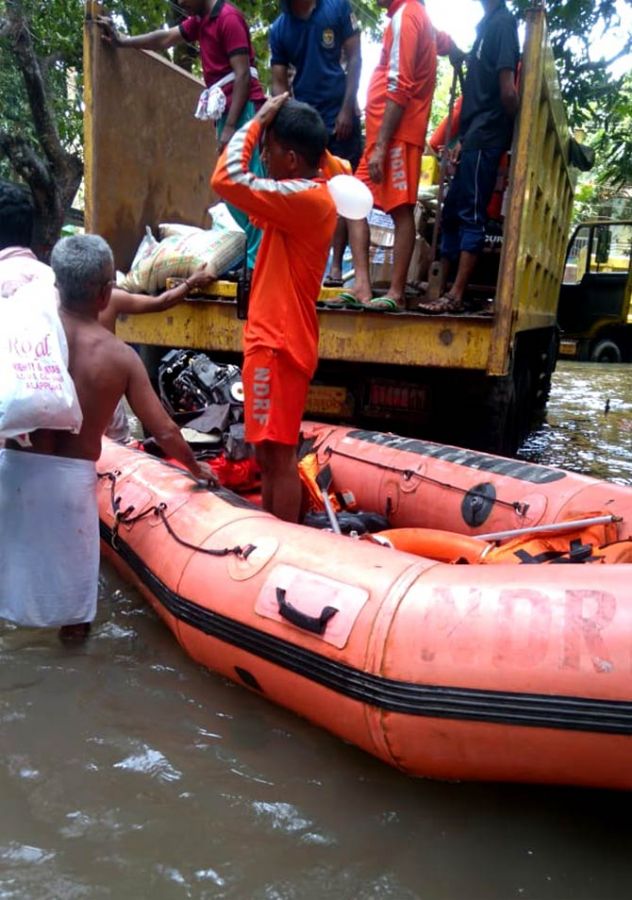 NDRF personnel and local villagers provide assistance
