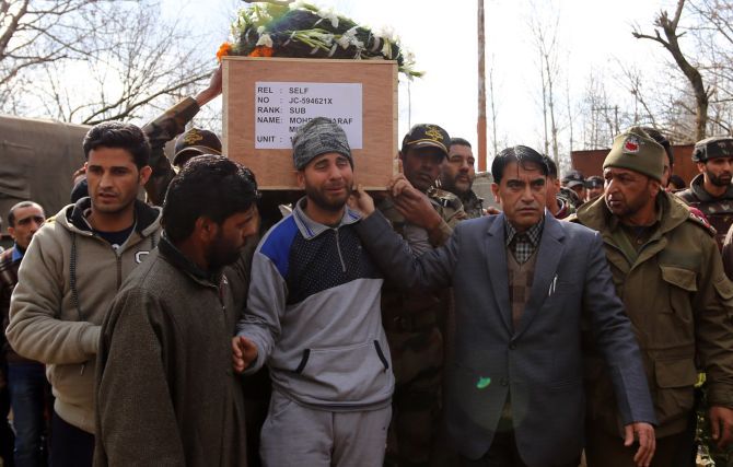 February 13, 2018: Family members, Indian Army soldiers and locals in Kupwara carry the body of JCO Mohammad Ashraf Mir, the Kashmiri soldier who was martyred in the terrorist attack at the Sunjuwan army camp attack. Photograph: Umar Ganie