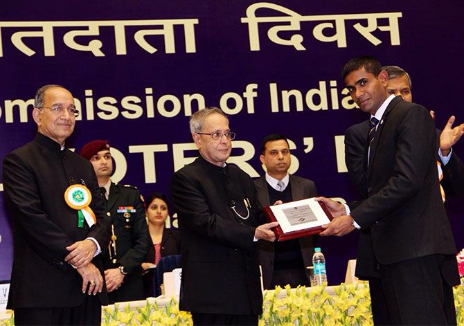 Pradeep Arya receiving an award from President of India for best electoral practice
