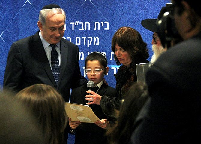 Israeli Prime Minister Benjamin Netanyahu with Moshe Holtzberg and his grandmother Yehudit Rosenberg at Chabad House, Mumbai, January 18, 2018