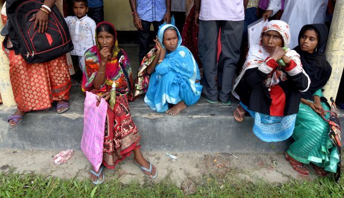Villagers wait outside an NRC centre to get their documents verified by government officials at Mayong Village in Morigaon district in Assam. Photograph: Reuters