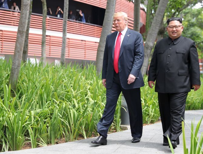 After their working lunch, United States President Donald J Trump and North Korean leader Kim Jong Un take a brief stroll around the Capella Hotel in Singapore, June 12, 2018. Photograph: Jonathan Ernst/Reuters