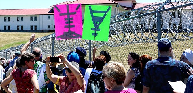 An Asian Pacific American Network of Oregon vigil outside the prison in Sheridan, Oregon, demanding that the asylum-seekers' civil rights not be violated
