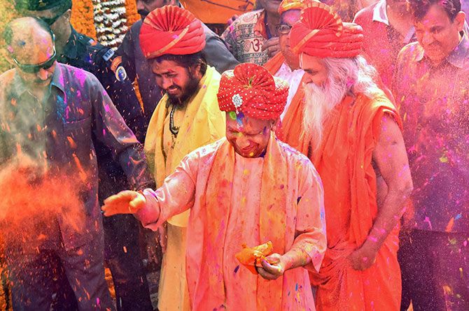 Uttar Pradesh Chief Minister Adityanath smeared with colour during Holi celebrations in Gorakhpur, March 2, 2018. Photograph: PTI Photo