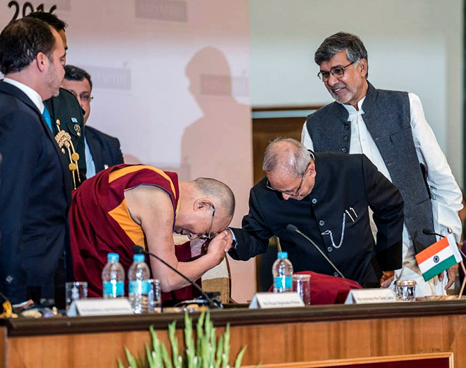 The Dalai Lama greets then President Pranab Mukherjee at the first Laureates and Leaders for Children Summit in Rashtrapati Bhavan, Dece,ber 10, 2016. Photograph: Kind courtesy@Office of Dalai Lama