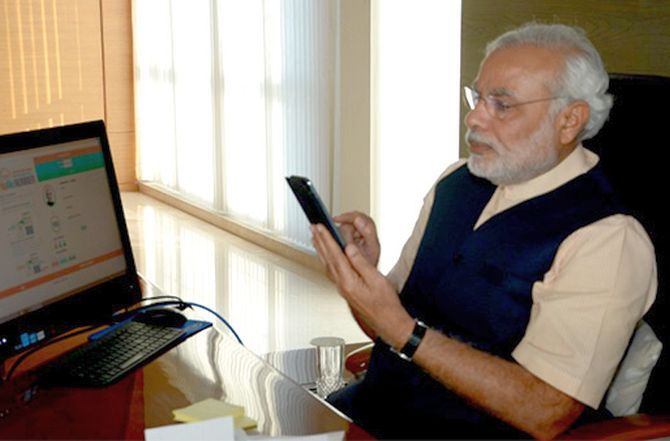 Prime Minister Narendra D Modi with the Narendra Modi App