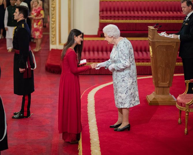 Suhani receives the Queen's Young Leader Award from Queen Elizabeth II at Buckingham Palace last year.