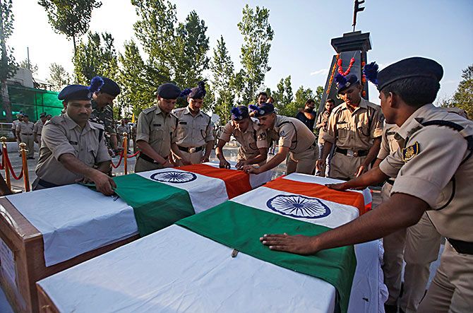 The coffins of two policeman killed in a militant attack in South Kashmir in July