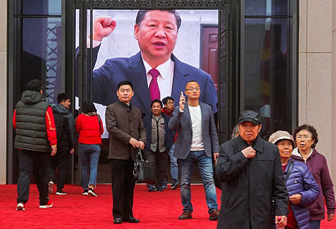 A screen shows President Xi Jinping at an exhibition marking the 40th anniversary of China's reforms at the National Museum of China in Beijing, November 14, 2018. Photograph: Thomas Peter/Reuters