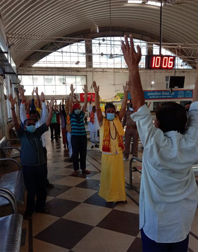 A yoga session for the passengers who has been marooned at the Varanasi railway station for more than a month