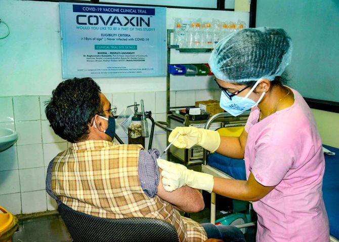 A medic administers Covaxin, developed by Bharat Biotech in collaboration with the Indian Council of Medical Research, during the Phase- 3 trials at the People's Medical College in Bhopal, December 7, 2020. Photograph: PTI Photo