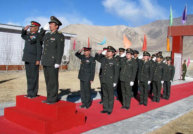 Major General Somnath Jha, left, takes the salute along with his Chinese counterpart after a border personnel meeting in Ladakh. Photograph: Major General Somnath Jha