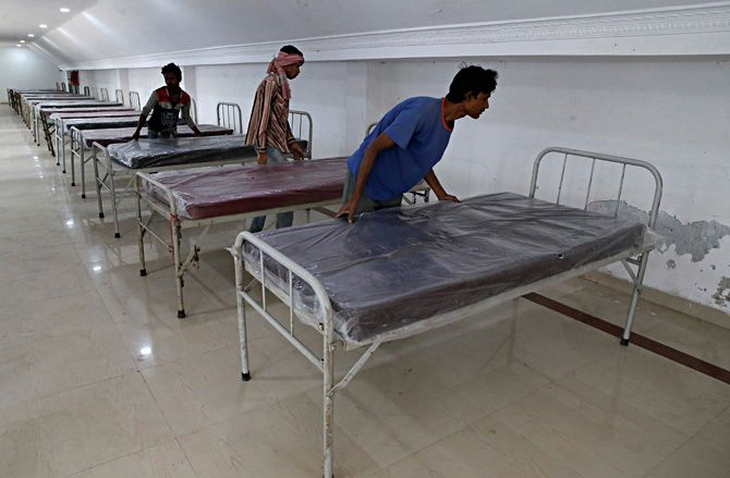 Workers prepare beds to set up a quarantine facility amid concerns about the spread of coronavirus in Howrah on the outskirts of Kolkata, March 19, 2020. Photograph: Rupak De Chowdhuri/Reuters