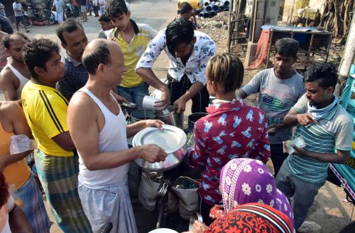 People buy milk in Kolkata amid the lockdown
