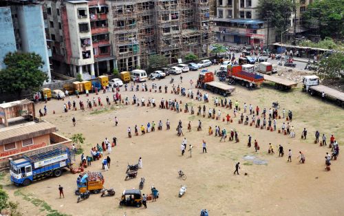 People queue up to collect LPG cylinders in Navi Mumbai