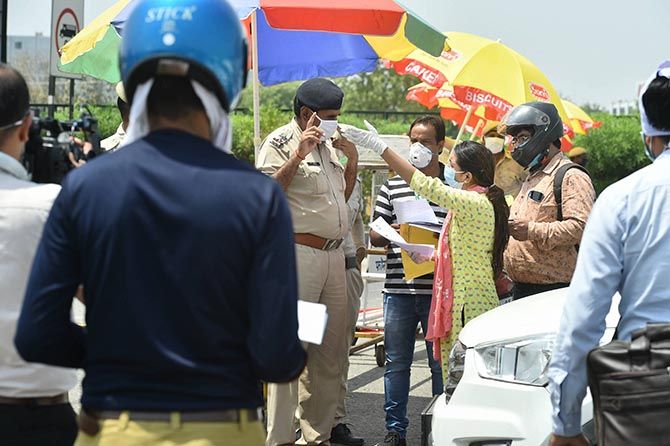Commuters request police personnel for permission to cross the Delhi-Gurugram border. The border was sealed by the Haryana government on May 1 due to a surge in COVID-19 cases. It will remain shut till further orders.