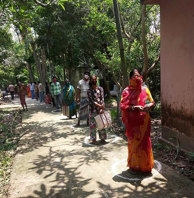 Villagers queue up to receive rations in Taki village, West Bengal. Photograph: Kind courtesy Arup Sengupta