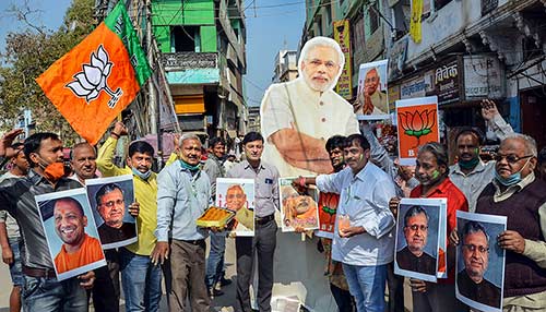 BJP workers in Varanasi celebrate the NDA's lead in the Bihar polls