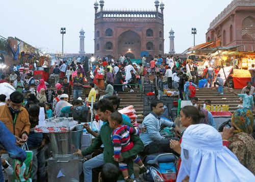 People shop at a market in Delhi