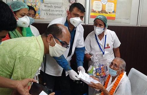 Mai Handique being felicitated by doctors after her recovery