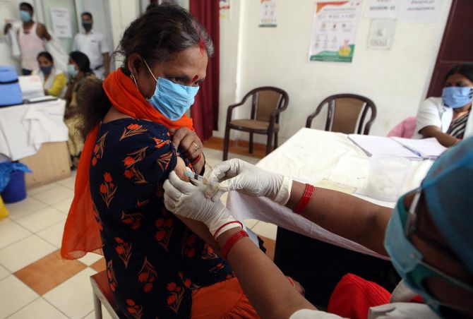 A woman receives a dose of the Covishield vaccine in Prayagraj. Photograph: ANI Photo