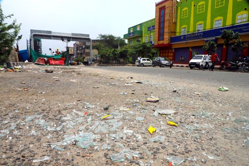 Shattered glass pieces from a bus at Khazoori Khas in New Delhi
