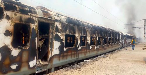 Charred remains of a train coach in Lakhisarai, Bihar